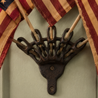 Five Tea-Stained Flags In A Rustic Cast Iron Wall Display